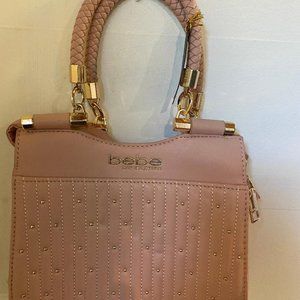 Pink purse bebe w/ small mark on back (New)